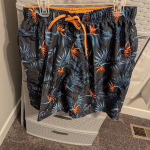 Men's Black Tropical Print Swim Trunks with Orange Accents